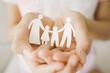 hands holding paper family cutout, foster care, homeless support, world mental health day, Autism support,homeschooling concept