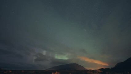 Wall Mural - Enchanting show of the aurora borealis in the dark night sky.