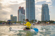 Summer vacation with kids in Miami beach. Kid and Summer sea. Child boy paddling on paddle board or sup. Summer lifestyle. Summer Water sport. Kid Boy swimming with paddle board.