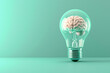 © xadartstudio - A 3D illustration of a crystal-clear light bulb with a luminous brain inside, placed on a pastel mint background for a fresh idea concept