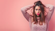 A woman overwhelmed with stress and concern confusion portrait isolated pink background