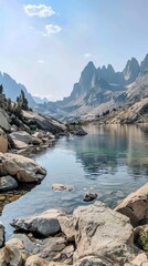 Wall Mural - A mountain range with a lake in the foreground. The lake is calm and the mountains are in the background