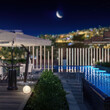 Architectural Visualization of an Exterior Restaurant with a Swimming Pool Deck and Breathtaking City Panorama under the Moon - 3D Visualization