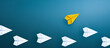 Group of paper plane in one direction and with one yellow paper plane individual pointing in the different way. Business concept for new ideas creativity and innovative solution