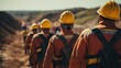 © photolas - View from behind many working miners in protective helmets and soiled overalls. A lot of construction workers on a building site.