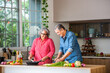 © StockImageFactory - Senior Indian asian couple in kitchen, cooking healthy food together and happy in retirement lifestyle.