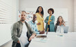© Flamingo Images - Confident team of diverse businesspeople working in an office boardroom