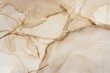 A closeup of an elegant marble surface with veins in beige and white, adorned in the style of thin golden lines that shimmer like liquid gold, creating intricate patterns on the stone's texture.