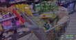 Image of stock market data processing over shopping cart full of groceries at grocery store