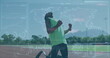 Mixed-race high schooler in green shirt, black shorts runs on track