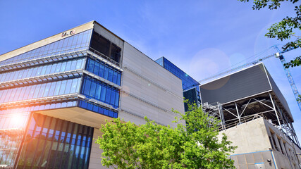 Wall Mural - Architectural facade building with of glass elements. Exterior of a modern industrial building.
