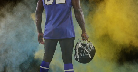 Poster - Image of colourful powders over american football player