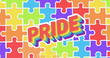 Image of pride text over rainbow puzzle