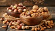 Different varieties of nuts In a wooden bowls over rustic background. Hazelnuts, almonds, pistachios.
