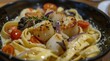 Fettuccine with creamy sauce and scallops, mushrooms, tomatoes, red onion and parmesan cheese.