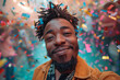 © Sergio - Smiling man with dreadlocks at confetti celebration