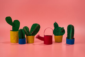 Wall Mural - cactus made of paper craft, recycling paper concept, pink background