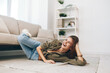 © SHOTPRIME STUDIO - Comfortable Living: Woman Relaxing on Cozy Sofa in Modern Apartment
