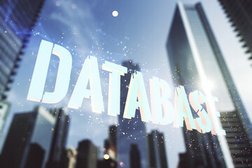 Wall Mural - double exposure of creative database word hologram on modern skyscrapers background, research and de