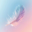Colored bird feather floating in air on gradient background copy space