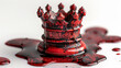 melting red crown, surrounded by dark red liquid on white background
