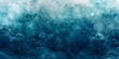 © tanapat - Abstract teal watercolor background with dark blue stormy sky texture.