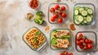 Neatly packed meal prep containers with a balance of proteins and fresh vegetables
