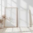 Empty frames mockup in a white room with a wooden floor.