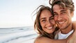 © Danko - Close up portrait of a beautiful young couple smiling on a summer day at the beach