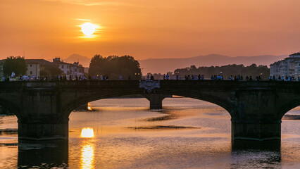 Poster - Cityscape view on Arno river with famous Holy Trinity bridge timelapse on the sunset in Florence