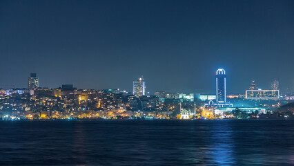 Wall Mural - Night timelapse view of besiktas district in istanbul taken from asian part of the city.