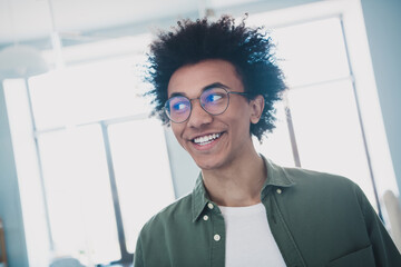 Poster - Photo of handsome cool assistant dressed khaki shirt glasses smiling indoors workstation workplace