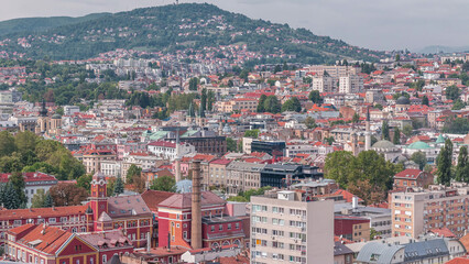 Wall Mural - Aerial view of Sarajevo old town roofs and houses on the hills timelapse, Sarajevo, Bosnia and Herzegovina