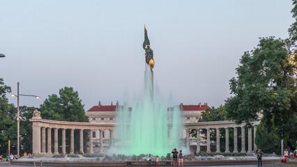 Sticker - The heroes monument of the red army in schwarzenbergplatz day to night timelapse at night with colorful light fountain in vienna, austria