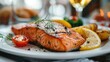 grilled salmon with potatoes on a white plate. Selective focus