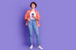 © deagreez - Full size photo of pretty young girl use smart phone wear shirt isolated on violet color background