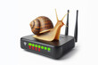 © Anna - snail crawling on a Wi-Fi router isolated on a white background. Slow internet concept