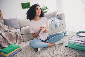 Sticker - Photo of dreamy cute girl sitting floor trendy clothes writing notes weekend resort preparation indoors