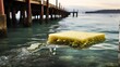 A sponge clinging to the underside of a pier, filtering water in a bustling harbor