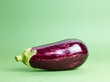 ripe eggplant over green background