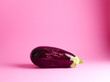 ripe eggplant over pink background
