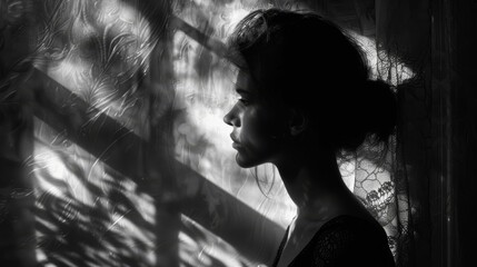 Wall Mural - A woman with a short afro is standing in front of a wall