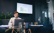 © Jacob Lund - Business man using a laptop, preparing to give a report on his market research before a conference meeting