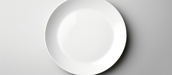 Poster - An empty white dish is seen from a top down perspective providing ample copy space for arranging food