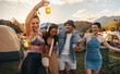 © Jacob Lund - Happy friends groove and celebrate together at a a music festival