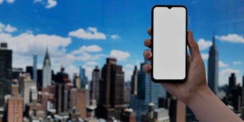 Wall Mural - Smartphone with blank screen over cityscape, ideal for urban tech promotions