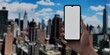Smartphone with blank screen over cityscape, ideal for urban tech promotions