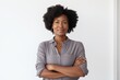 © Markus Schröder - Portrait of a content afro-american woman in her 40s with arms crossed in front of white background