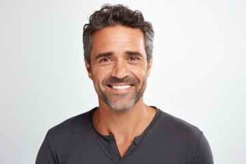 Wall Mural - Portrait of a blissful man in his 40s smiling at the camera on white background
