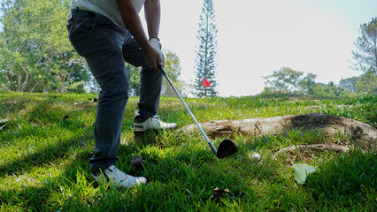 Wall Mural - Golfer are playing game golf and hitting go on green grass mountain background.